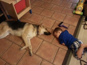 kelsey and braven laying with baby